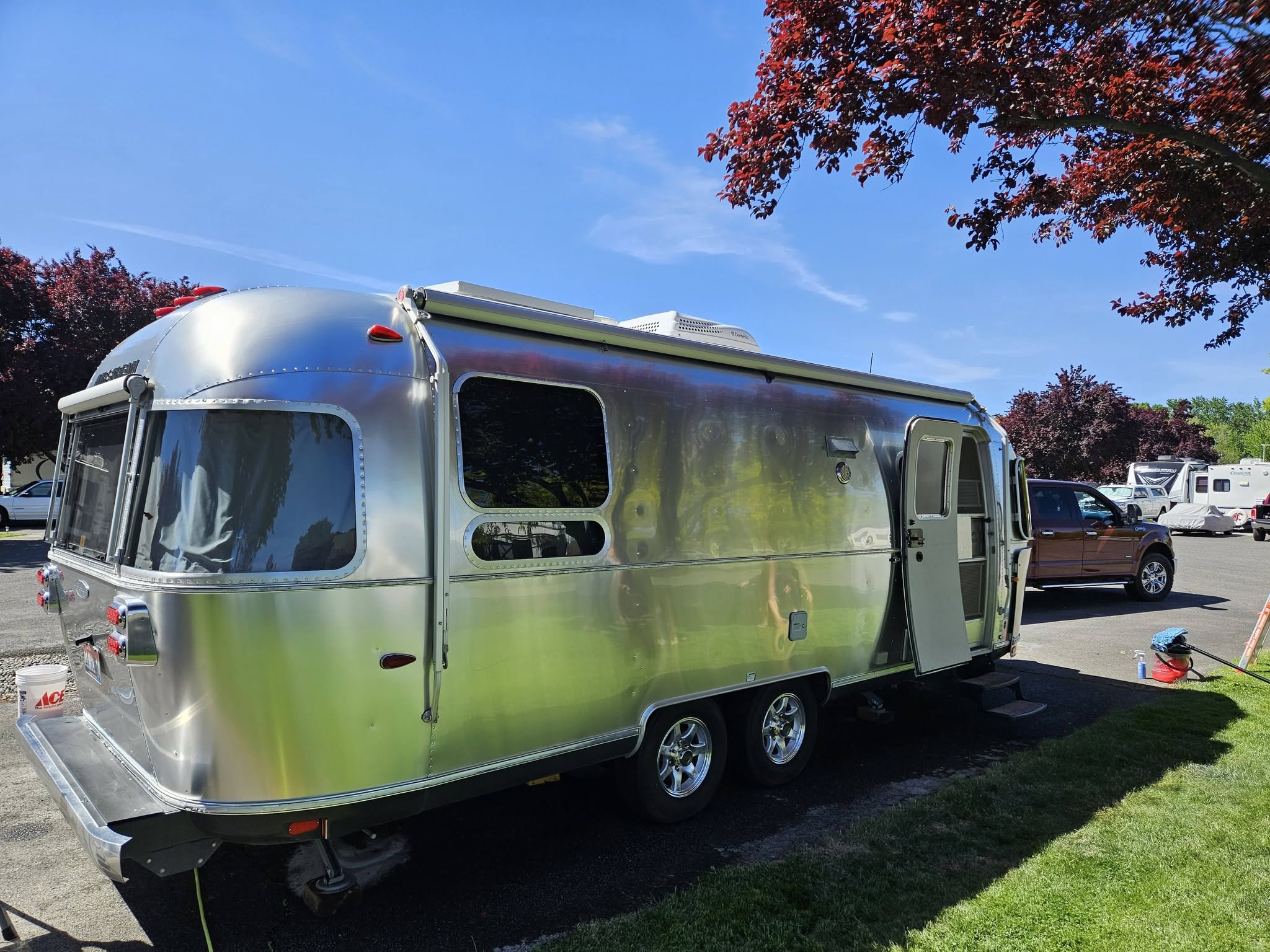 Polished Airstream trailer with its door open