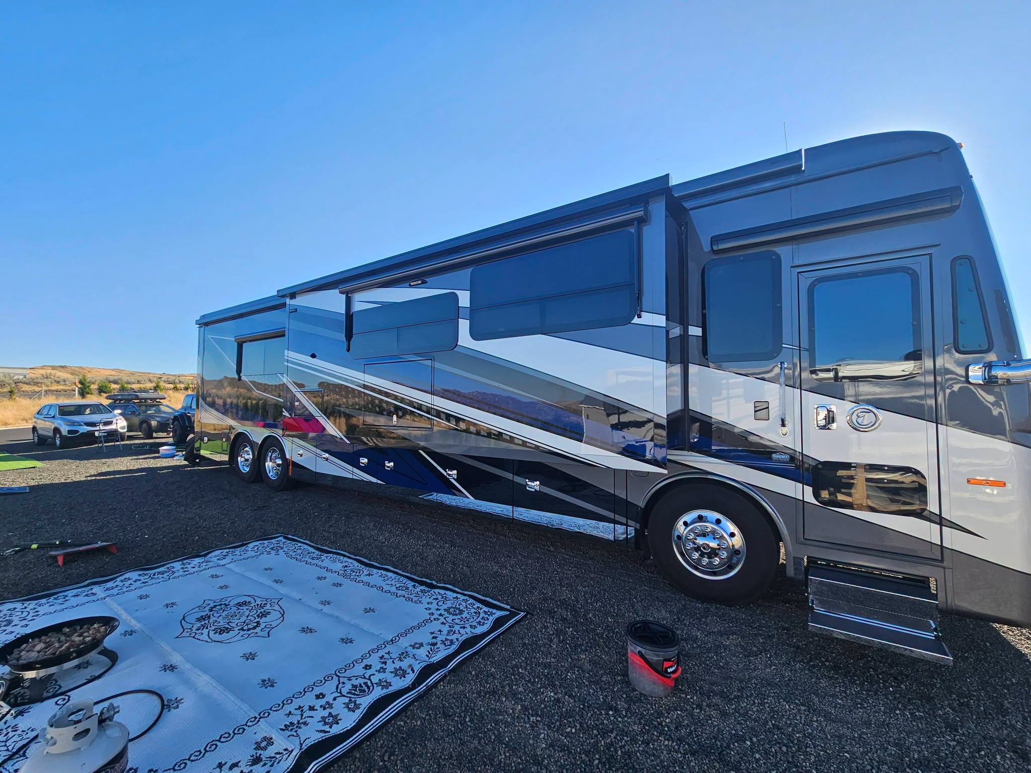 Silver and blue motorhome after exterior detailing